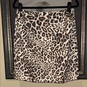 CAbi Sophia leopard skirt, zip back, hidden button closure, slit back size 6
